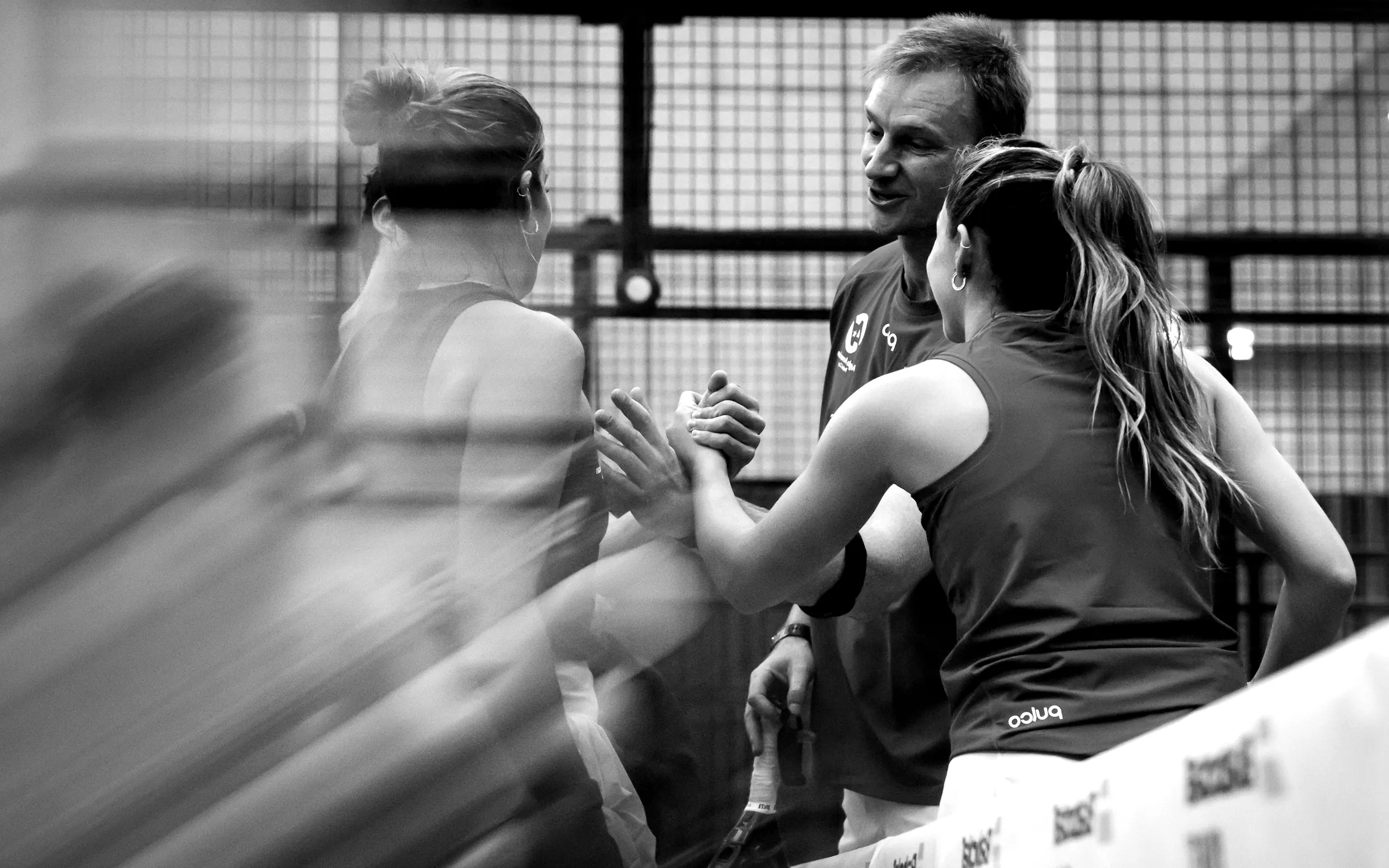 Padel business leaders greeting each other at the net